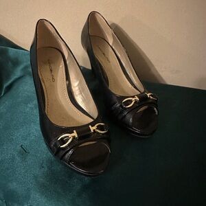 Black pumps with gold accents